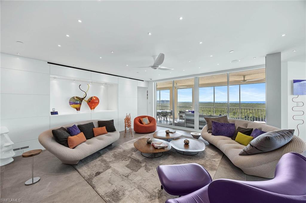 425 Dockside Drive, Unit 905 Naples, FL 34110 - Photo 18 of 50 a living room with furniture and a couch