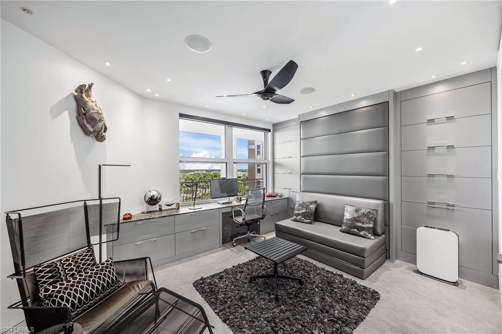 425 Dockside Drive, Unit 905 Naples, FL 34110 - Photo 24 of 50 a living room with furniture and a rug