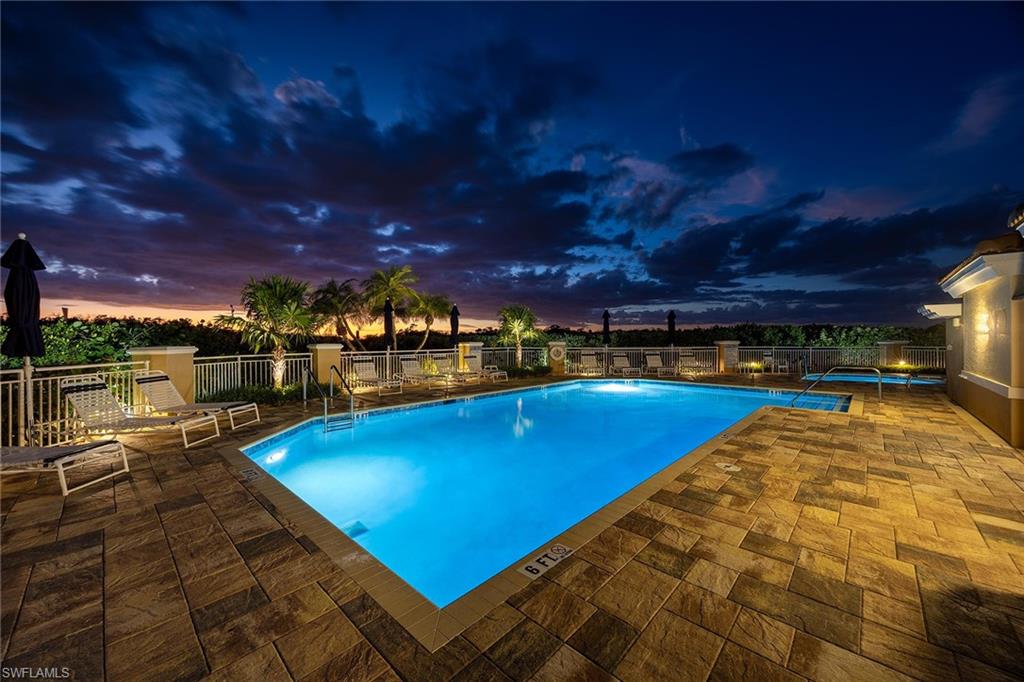 425 Dockside Drive, Unit 905 Naples, FL 34110 - Photo 29 of 50 a view of a swimming pool with an outdoor seating