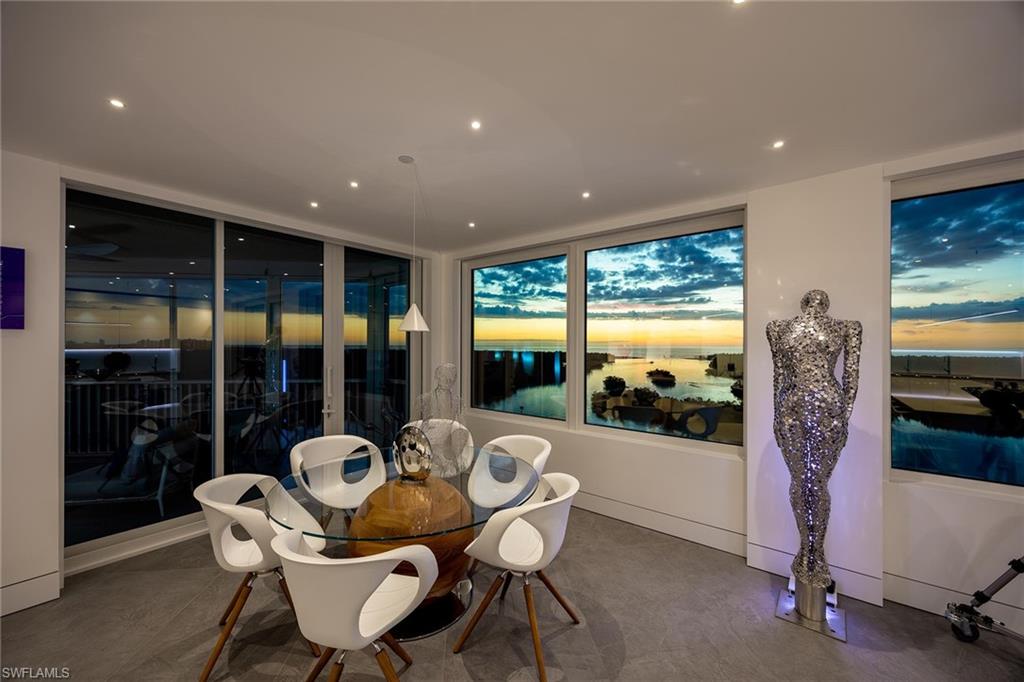 425 Dockside Drive, Unit 905 Naples, FL 34110 - Photo 3 of 50 a outdoor dining space with furniture and window