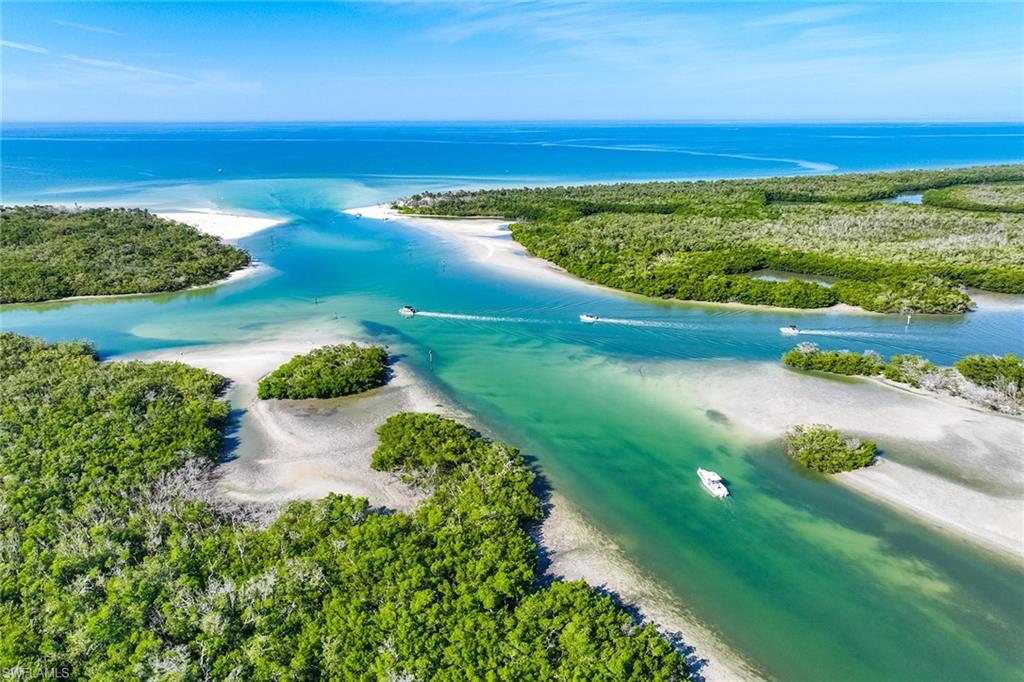 425 Dockside Drive, Unit 905 Naples, FL 34110 - Photo 4 of 50 a view of a lake with a lake
