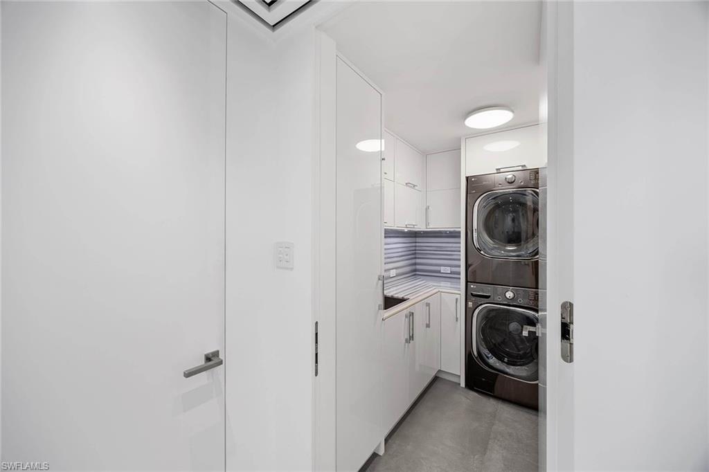 425 Dockside Drive, Unit 905 Naples, FL 34110 - Photo 50 of 50 a utility room with dryer and washer
