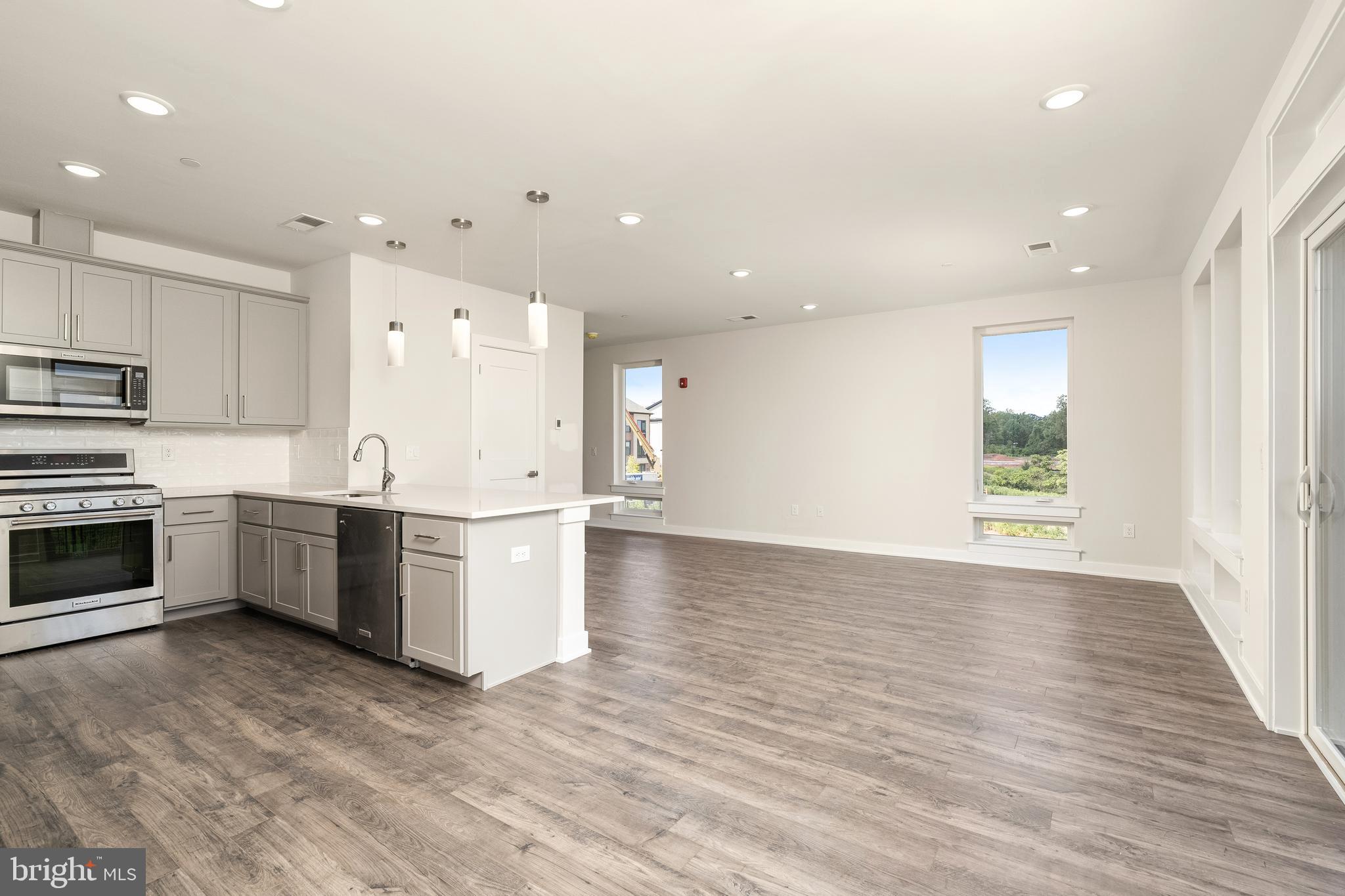 112 Village Drive Skillman, NJ 08558 - Photo 11 of 33 a view of kitchen with wooden floor and electronic appliances