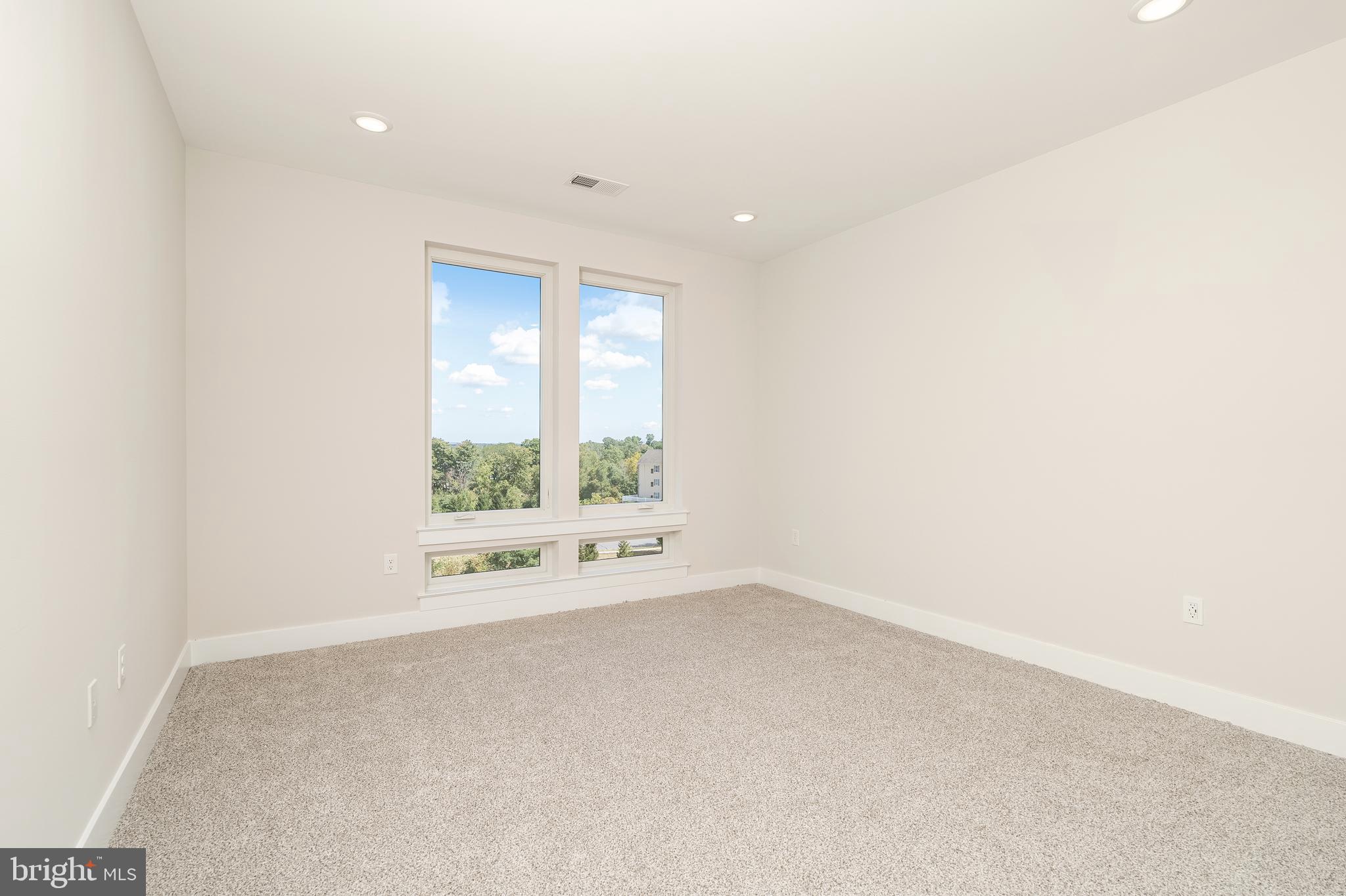 112 Village Drive Skillman, NJ 08558 - Photo 25 of 33 a view of an empty room with a window