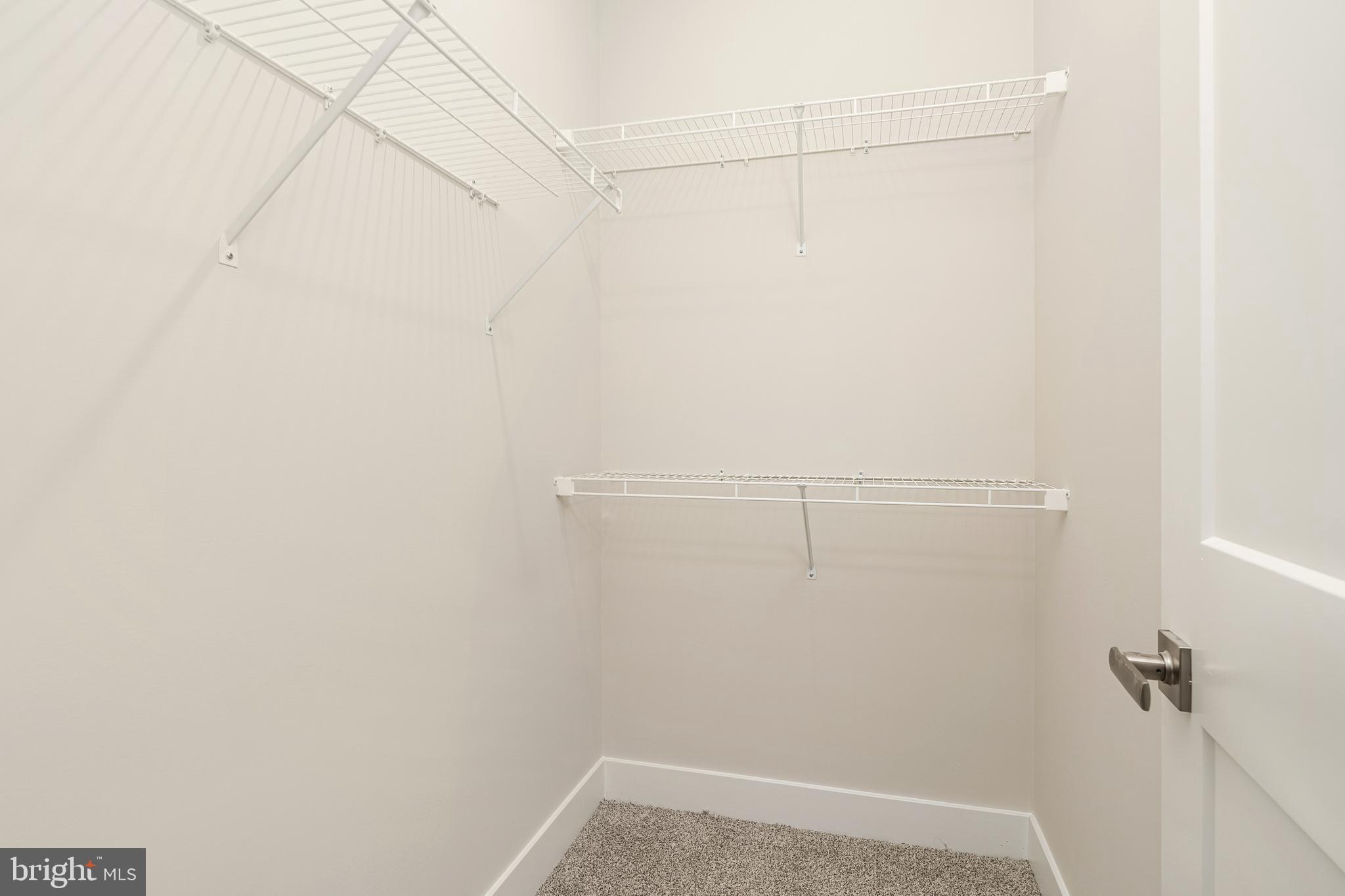 112 Village Drive Skillman, NJ 08558 - Photo 26 of 33 a view of a room with racks on the wall
