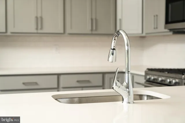 a kitchen with a sink and cabinets