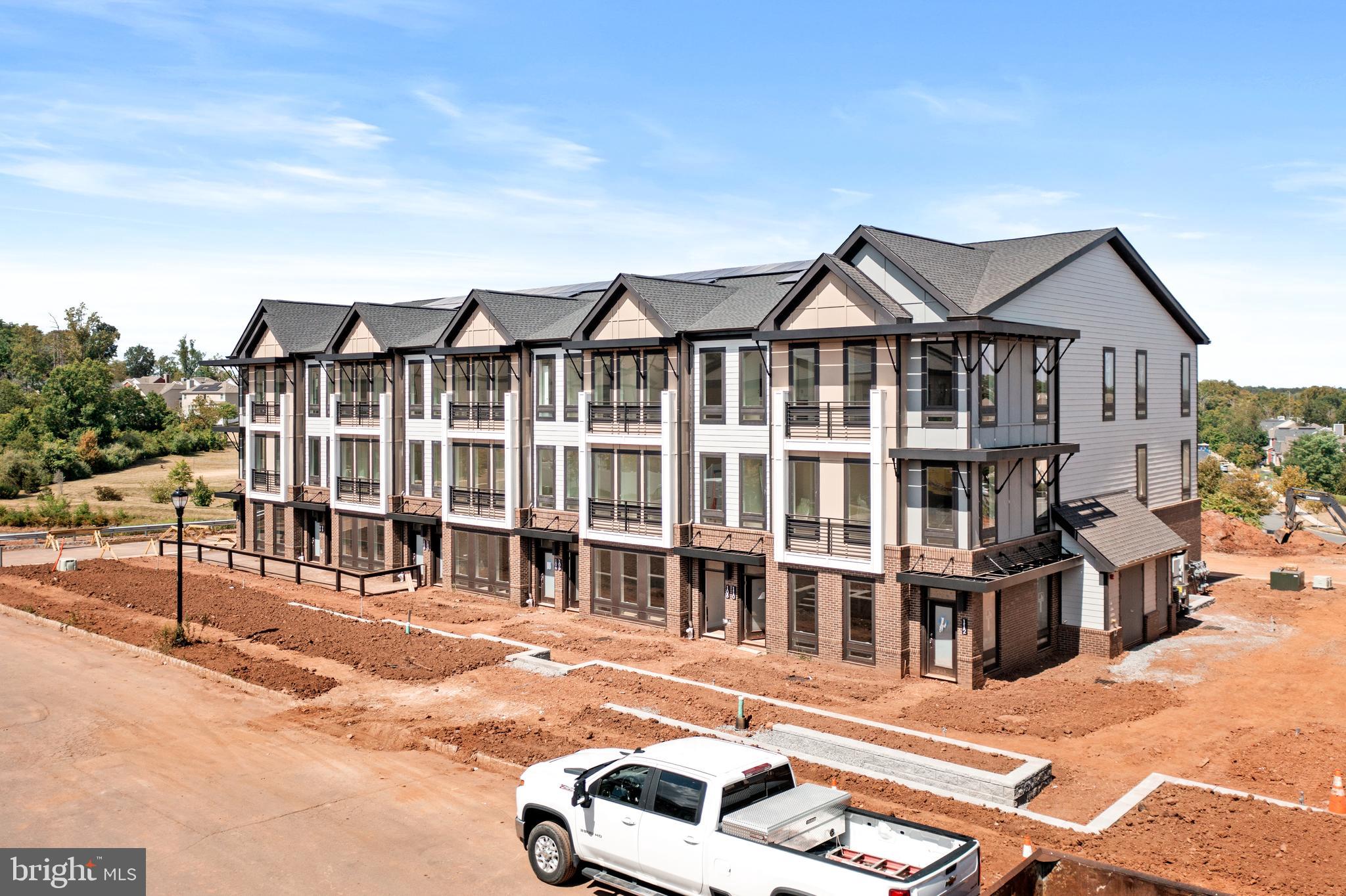 112 Village Drive Skillman, NJ 08558 - Photo 4 of 33 a front view of a house with a yard