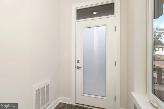 a view of a bathroom from a hallway