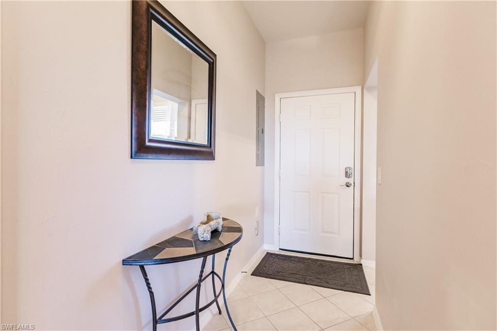 3820 Sawgrass Way, Unit 3043 Naples, FL 34112 - Photo 15 of 44 a view of a room that has a window and wooden floor