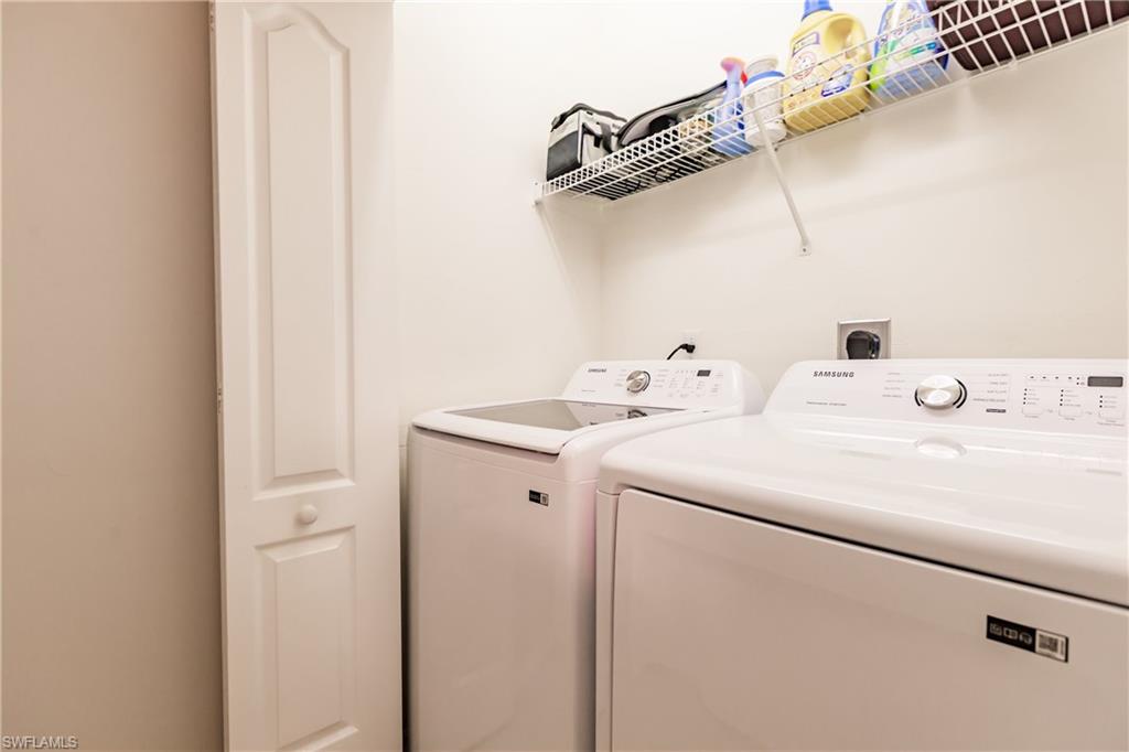 3820 Sawgrass Way, Unit 3043 Naples, FL 34112 - Photo 31 of 44 a utility room with dryer and washer