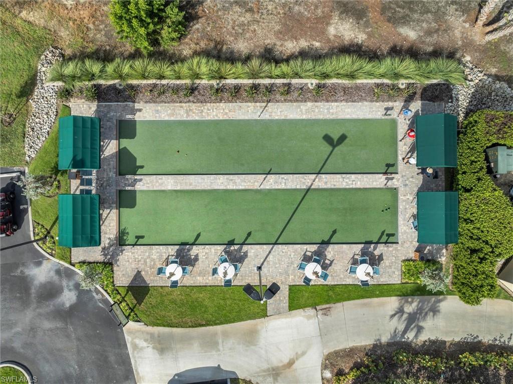 3820 Sawgrass Way, Unit 3043 Naples, FL 34112 - Photo 39 of 44 an aerial view of a house with a garden and houses