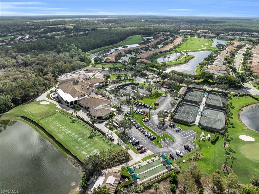 3820 Sawgrass Way, Unit 3043 Naples, FL 34112 - Photo 42 of 44 an aerial view of residential houses with outdoor space