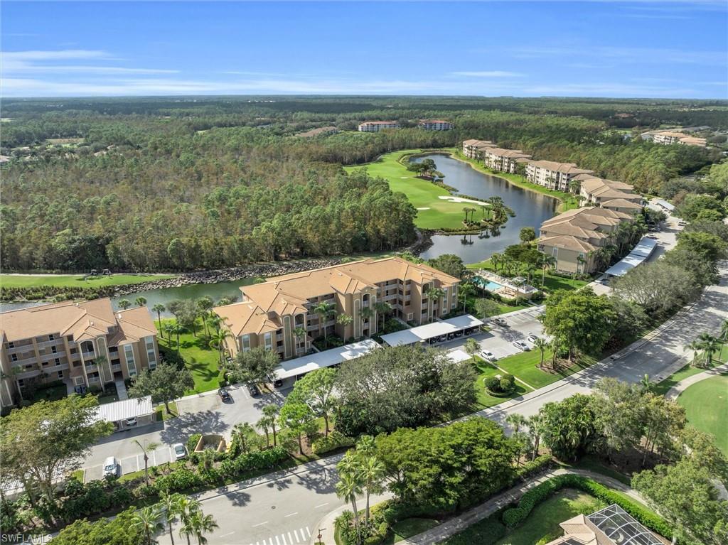 3820 Sawgrass Way, Unit 3043 Naples, FL 34112 - Photo 6 of 44 a view of a city with an ocean