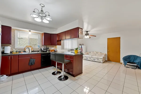 a bedroom with a bed and ceiling fan