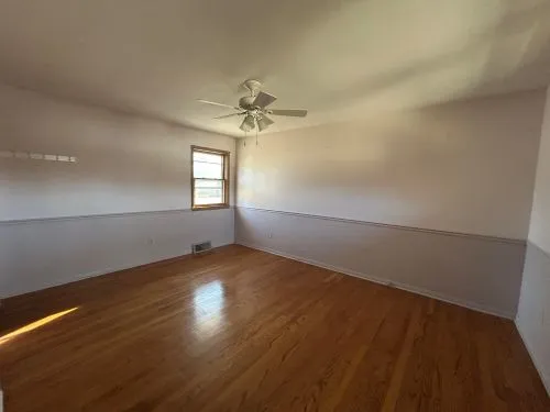 a view of hallway with wooden walls