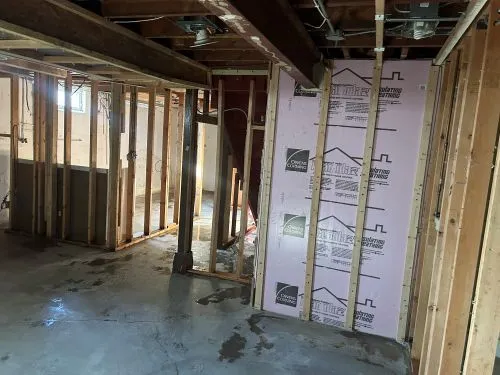 a bathroom with a glass shower door and a glass door