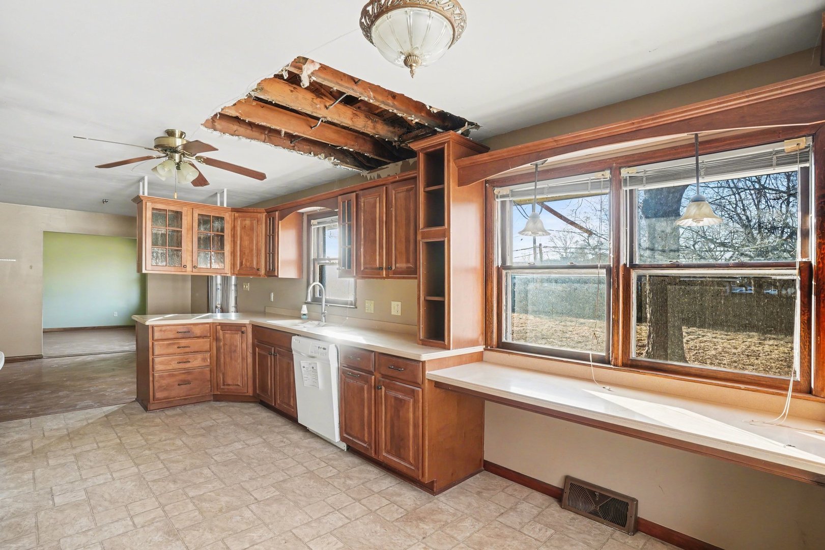 1124 West Hawkins Street Kankakee, IL 60901 - Photo 9 of 22 a view of a kitchen with large windows