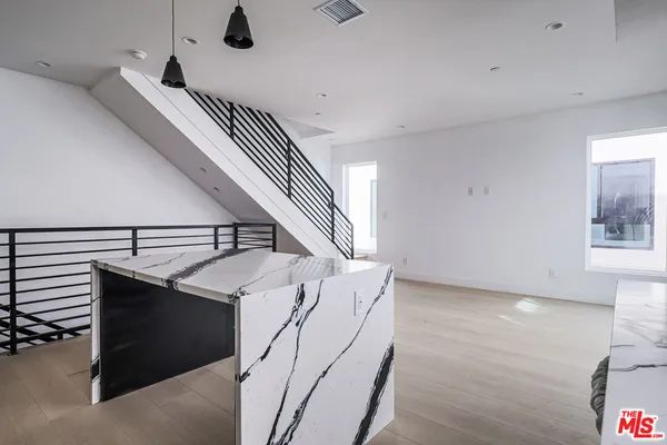 a view of entryway and kitchen