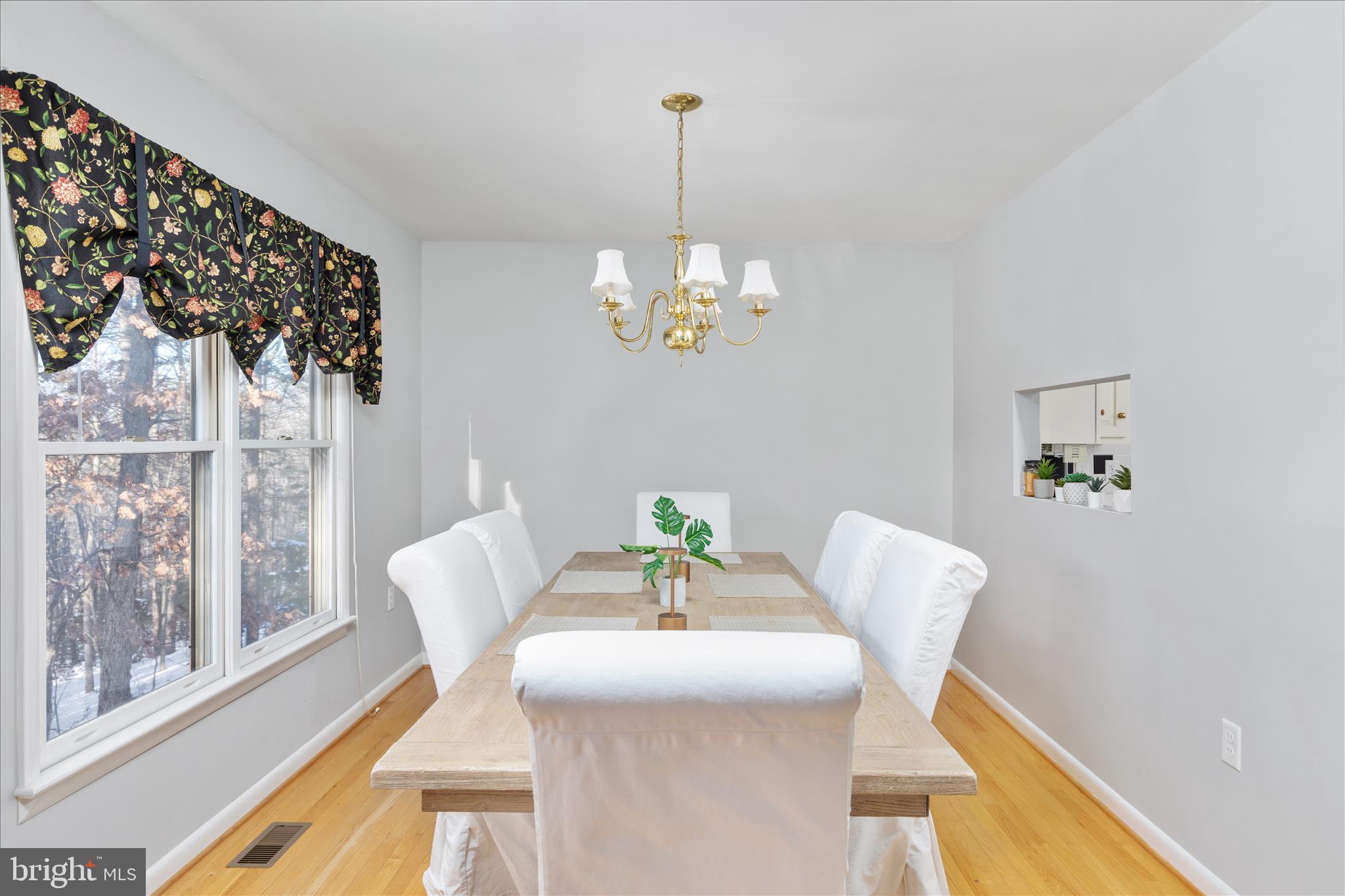 7239 Supinlick Ridge Road Mount Jackson, VA 22842 - Photo 13 of 39 a view of a dining room with furniture a chandelier and wooden floor