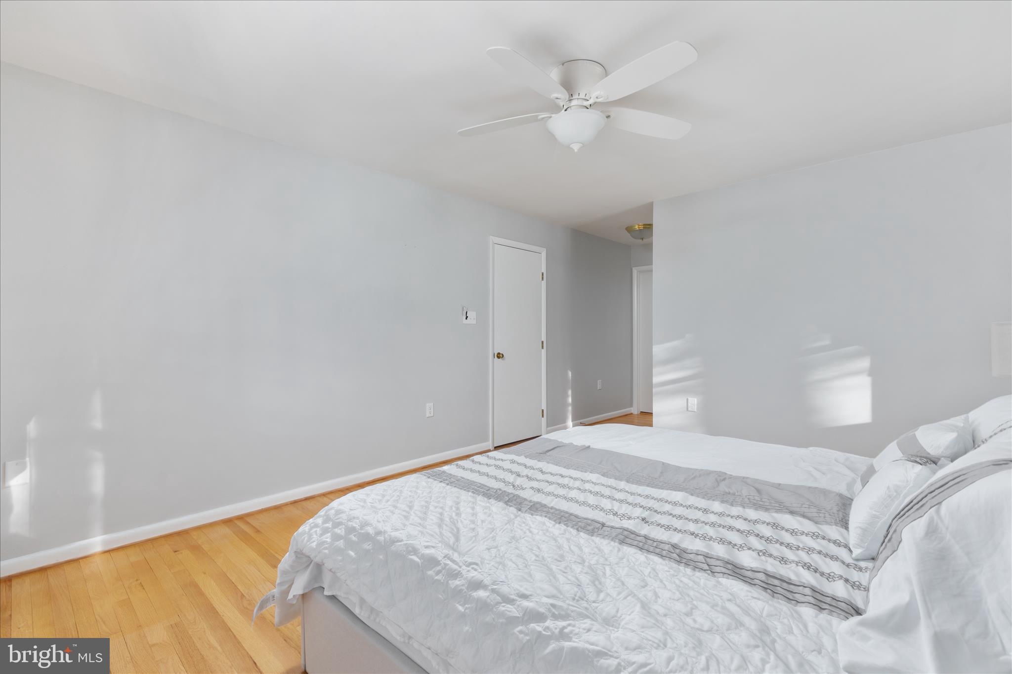 7239 Supinlick Ridge Road Mount Jackson, VA 22842 - Photo 18 of 39 a bedroom with a large bed and a chandelier