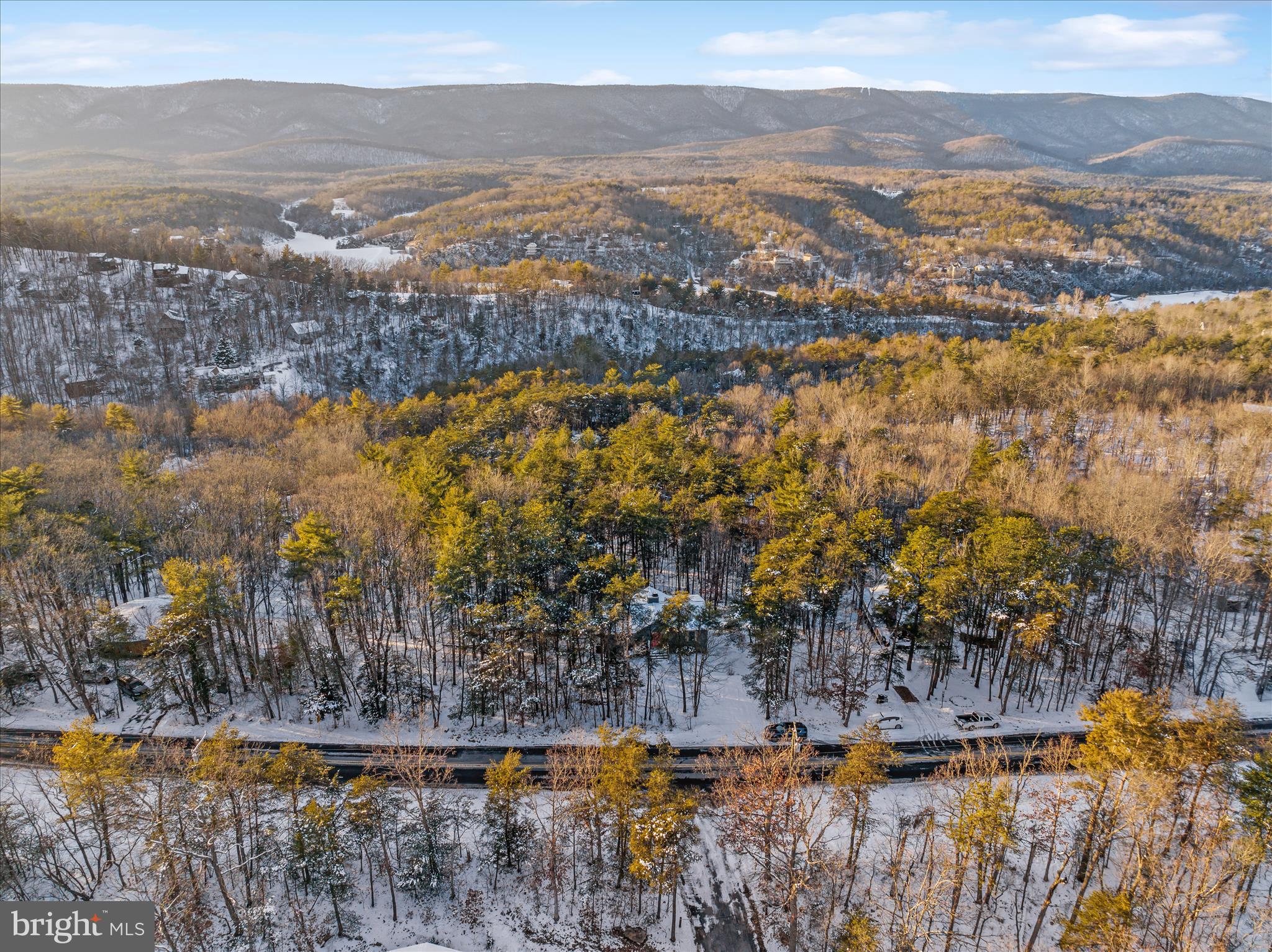 7239 Supinlick Ridge Road Mount Jackson, VA 22842 - Photo 31 of 39 a view of a town with mountains in the background