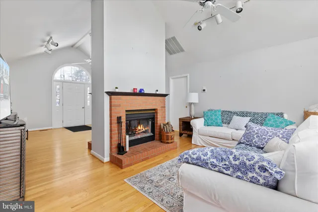 a kitchen with white cabinets and appliances