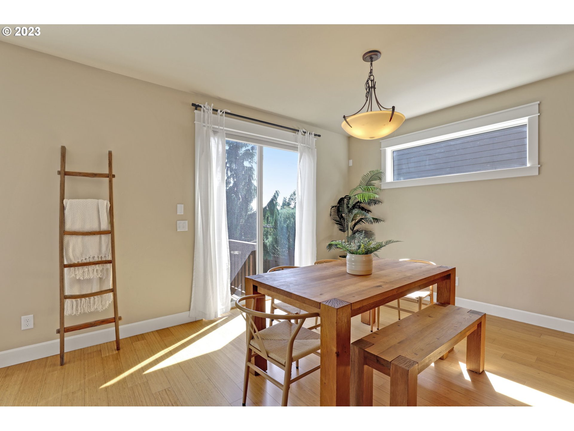 9806 Northwest Wayne Lane Portland, OR 97229 - Photo 11 of 21 a view of a dining room with furniture and wooden floor