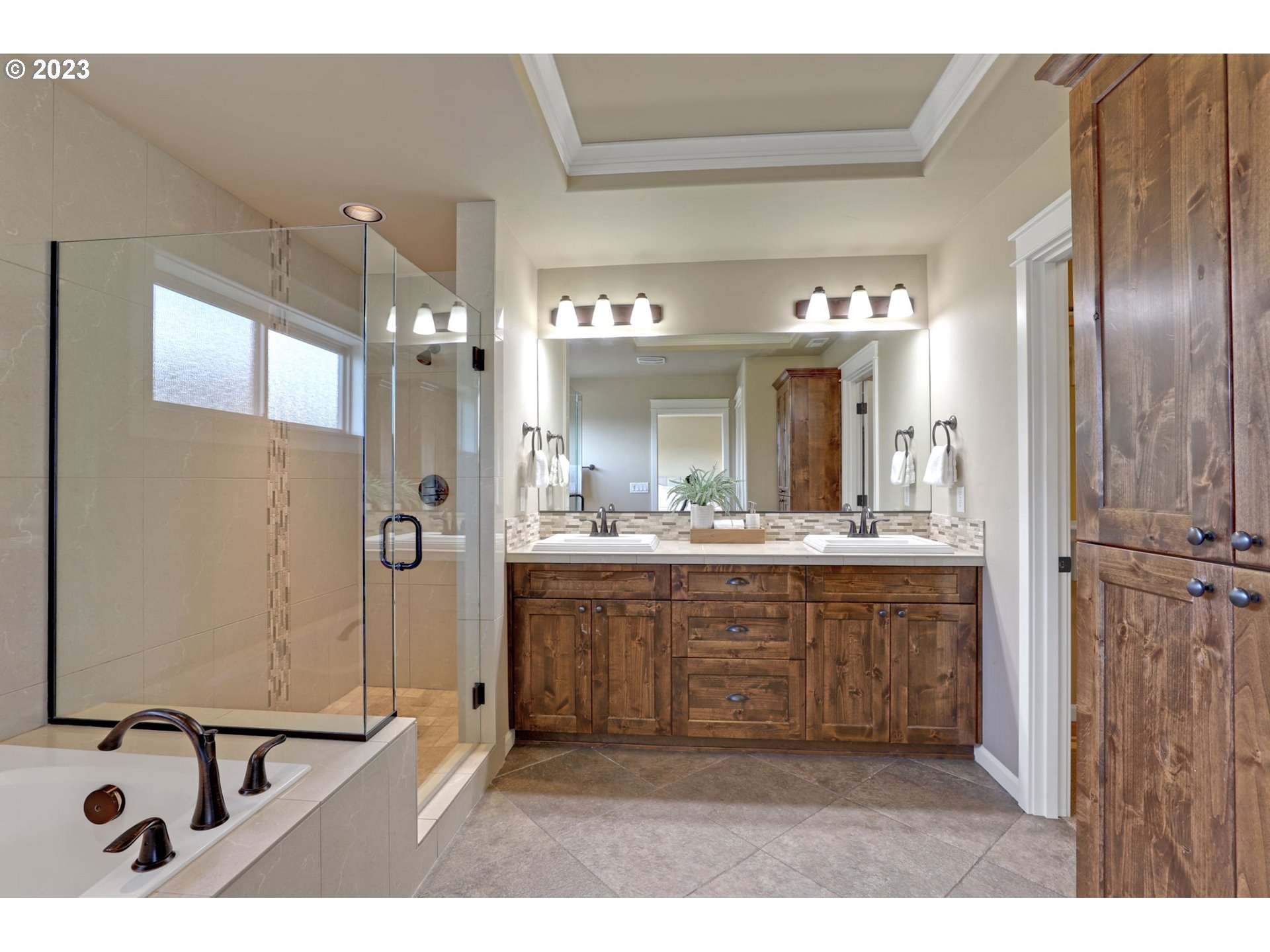 9806 Northwest Wayne Lane Portland, OR 97229 - Photo 13 of 21 a bathroom with a sink a mirror and a shower