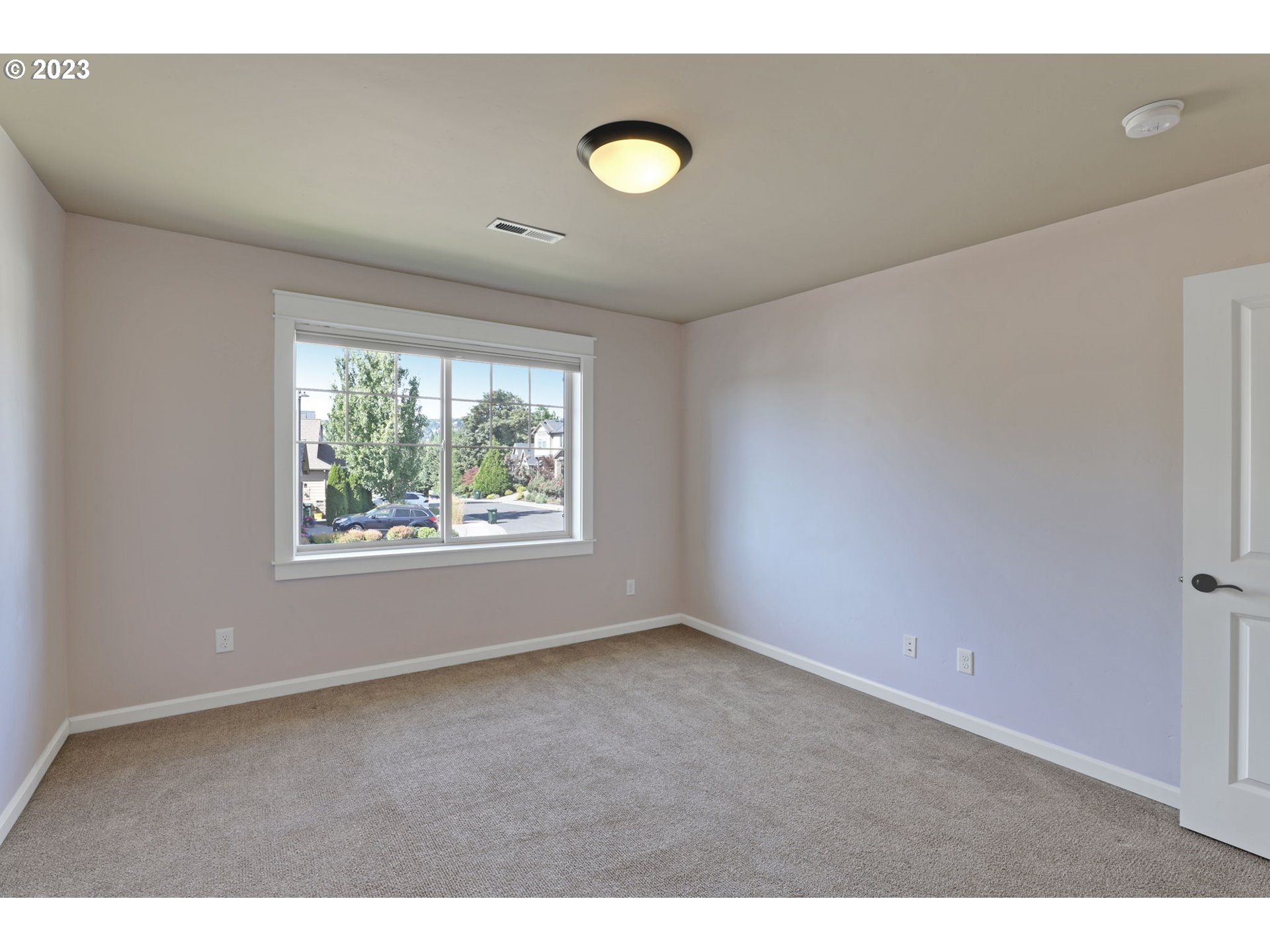 9806 Northwest Wayne Lane Portland, OR 97229 - Photo 18 of 21 a view of an empty room with a window