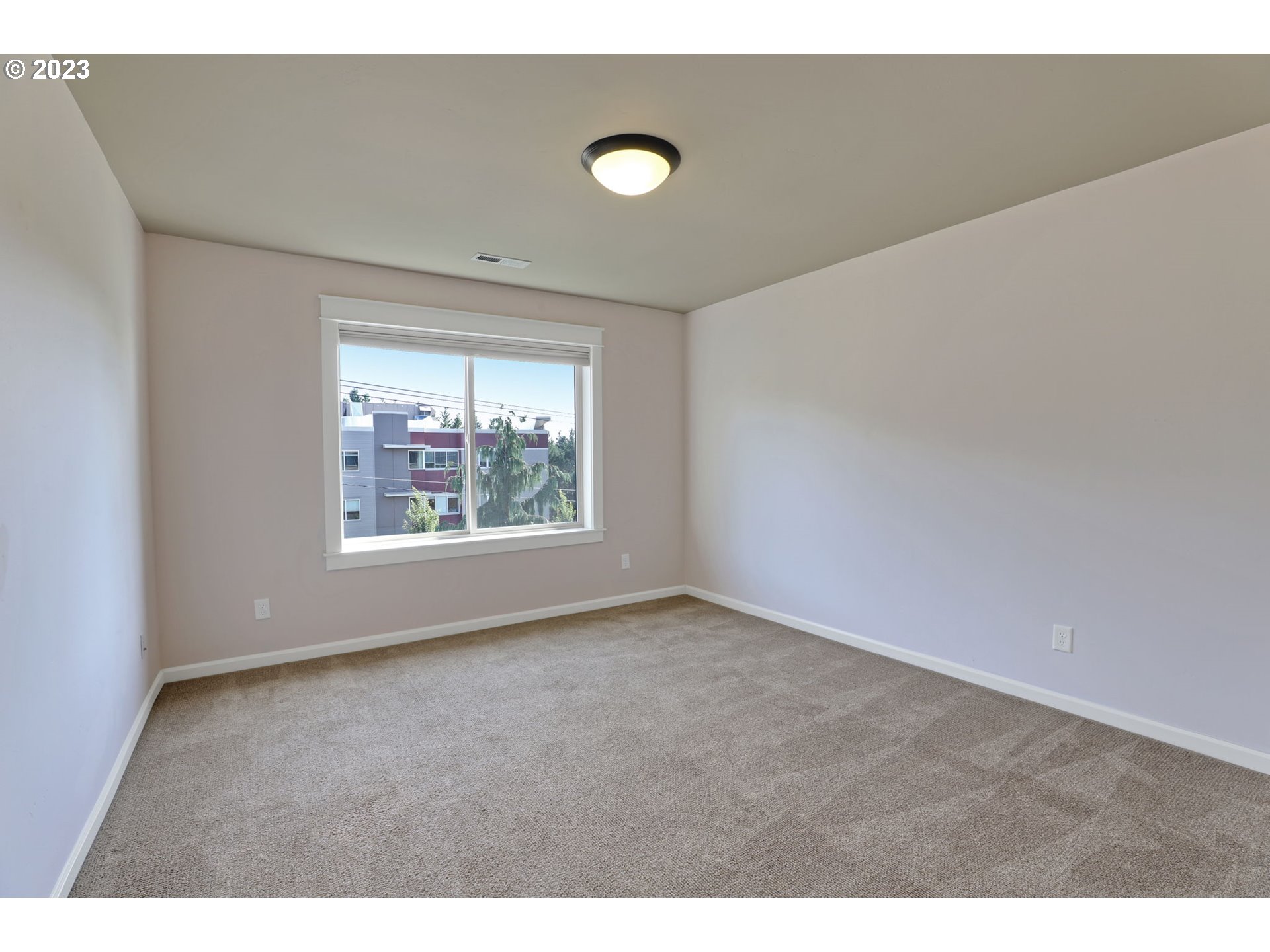 9806 Northwest Wayne Lane Portland, OR 97229 - Photo 19 of 21 a view of an empty room with a window