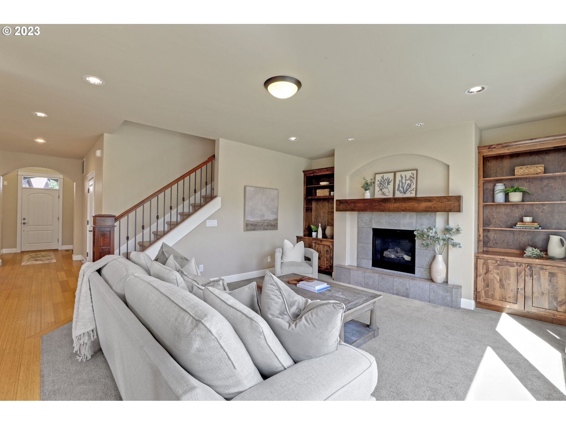 9806 Northwest Wayne Lane Portland, OR 97229 - Photo 2 of 21 a living room with furniture and a fireplace
