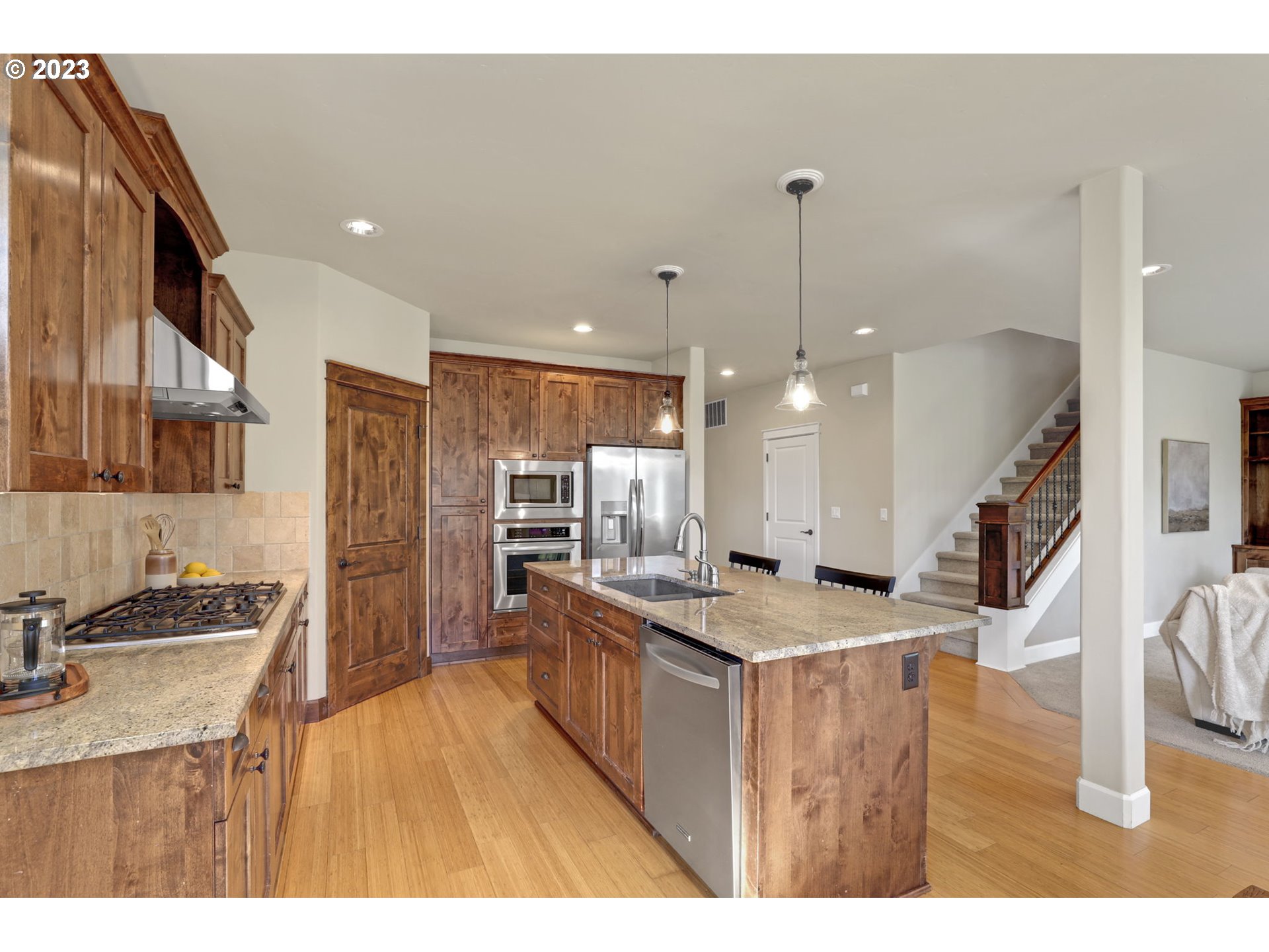 9806 Northwest Wayne Lane Portland, OR 97229 - Photo 5 of 21 a kitchen with stainless steel appliances granite countertop sink stove and refrigerator