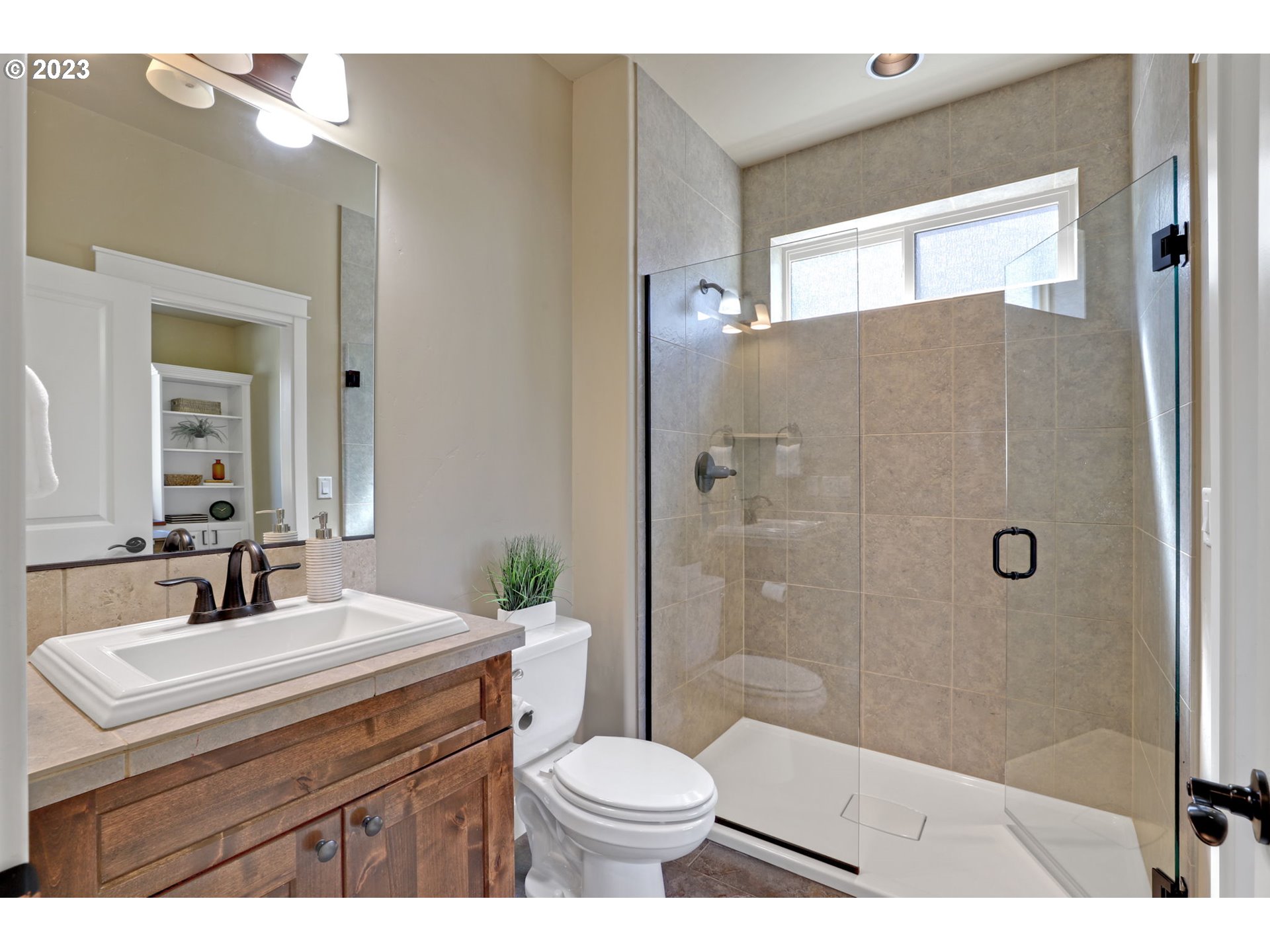 9806 Northwest Wayne Lane Portland, OR 97229 - Photo 9 of 21 a bathroom with a sink toilet a mirror and shower