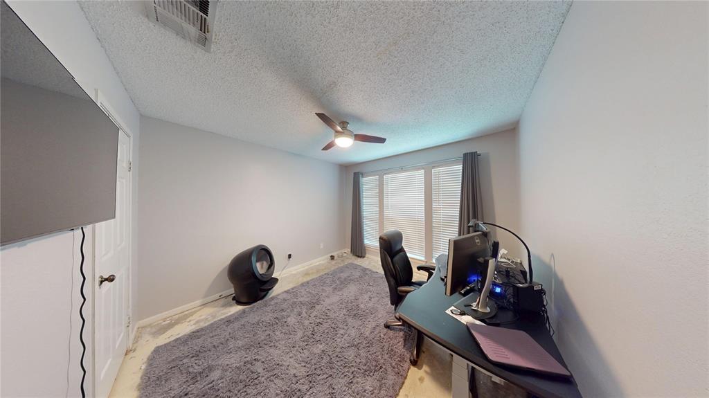 1317 Colonial Place Flower Mound, TX 75028 - Photo 12 of 20 Room featuring light gray walls, a window with blinds and dark drapes, and a ceiling fan with light fixture