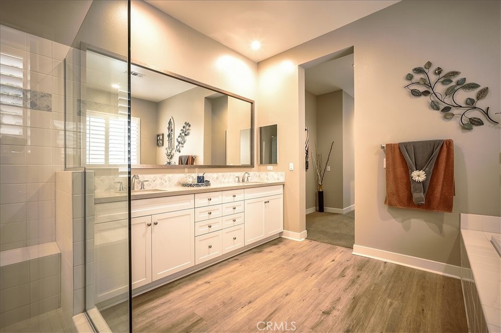 13471 Planet Court Riverside, CA 92503 - Photo 20 of 51 a spacious bathroom with a double vanity sink and a mirror
