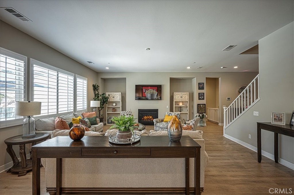13471 Planet Court Riverside, CA 92503 - Photo 24 of 51 a living room with fireplace furniture and a potted plant