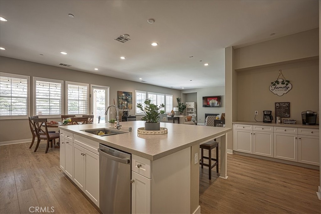 13471 Planet Court Riverside, CA 92503 - Photo 27 of 51 a kitchen with appliances a sink and cabinets