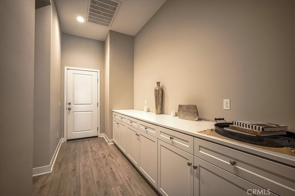 13471 Planet Court Riverside, CA 92503 - Photo 30 of 51 a spacious bathroom with a double vanity sink and a mirror