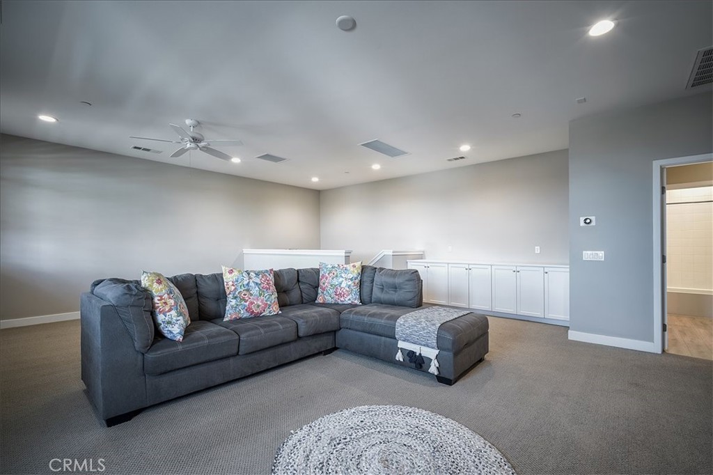 13471 Planet Court Riverside, CA 92503 - Photo 34 of 51 a living room with furniture and a couch