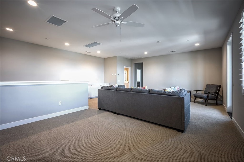 13471 Planet Court Riverside, CA 92503 - Photo 35 of 51 a living room with furniture and a ceiling fan