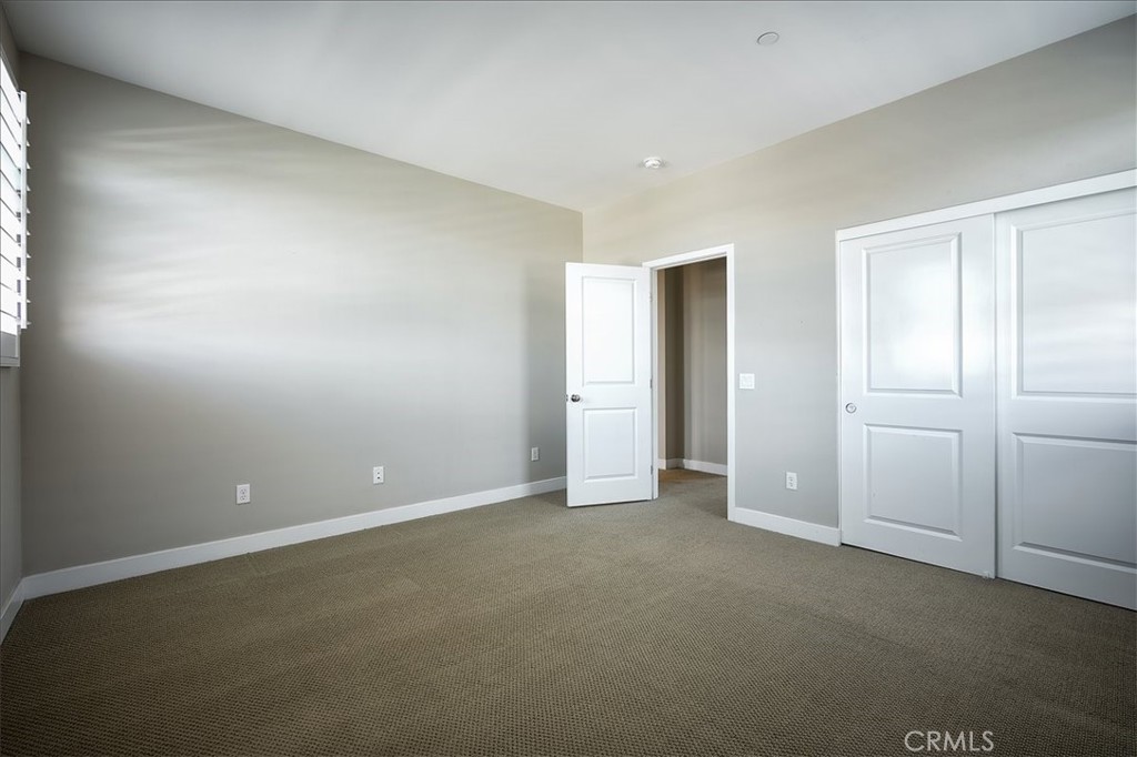 13471 Planet Court Riverside, CA 92503 - Photo 42 of 51 an empty room with closet area