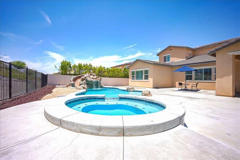 13471 Planet Court Riverside, CA 92503 - Photo 46 of 51 a swimming pool with outdoor seating and yard