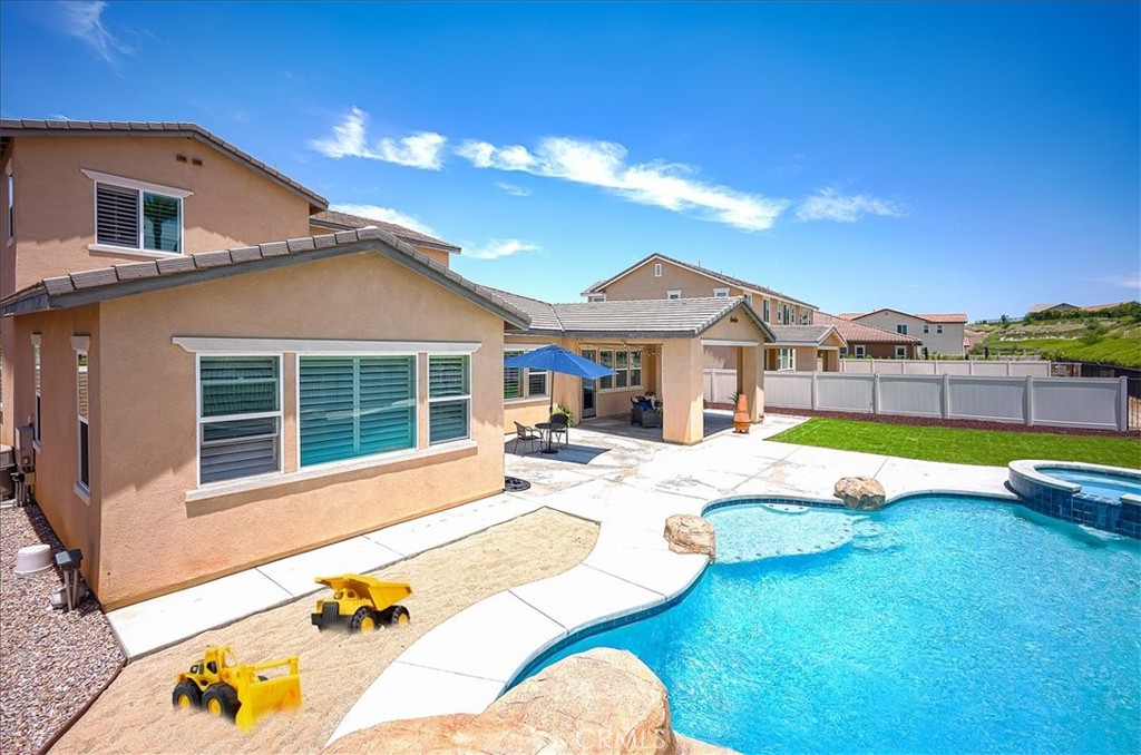 13471 Planet Court Riverside, CA 92503 - Photo 49 of 51 a view of a house with swimming pool and porch