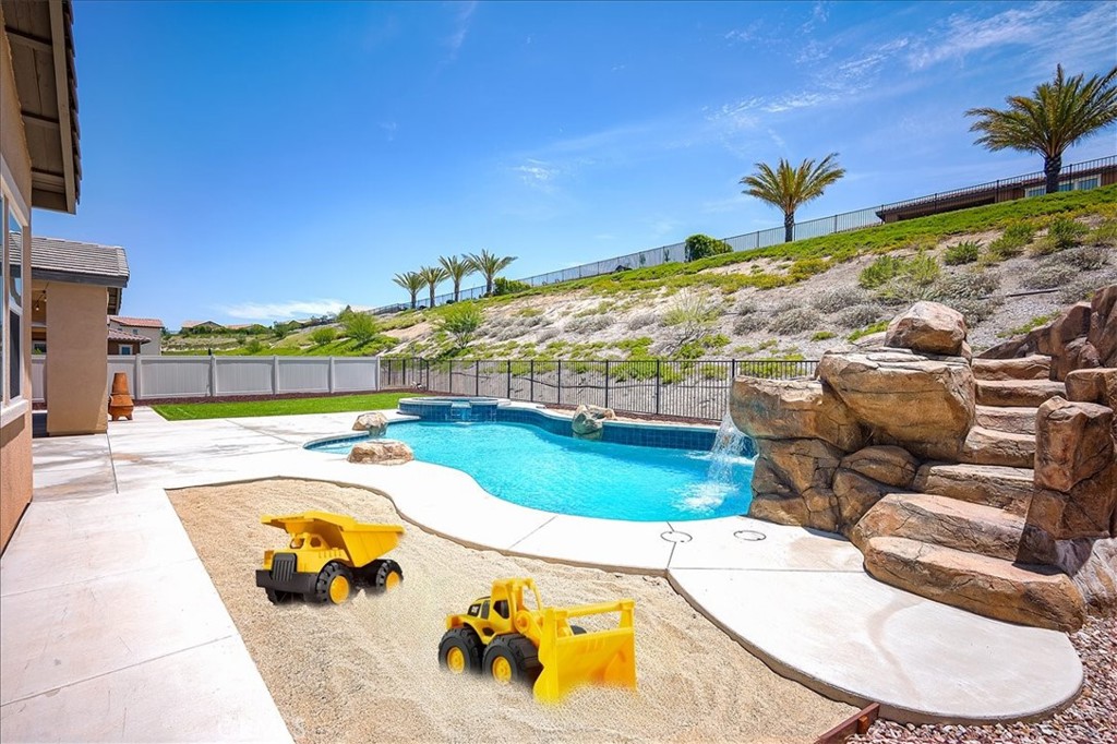 13471 Planet Court Riverside, CA 92503 - Photo 50 of 51 a view of a swimming pool with a patio
