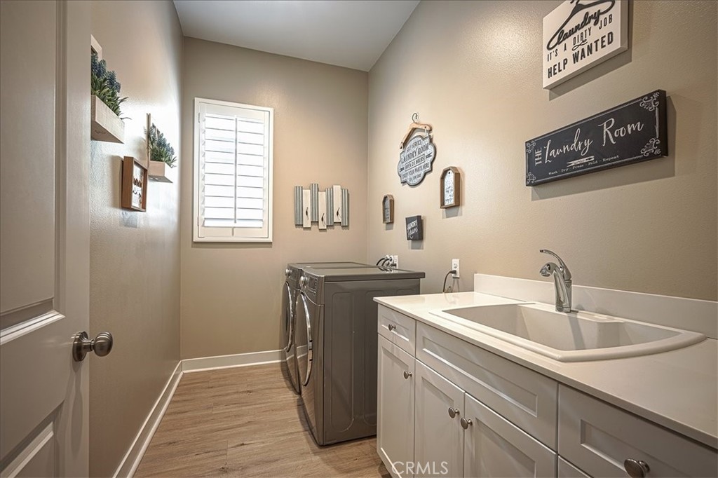 13471 Planet Court Riverside, CA 92503 - Photo 9 of 51 a utility room with a sink and a window