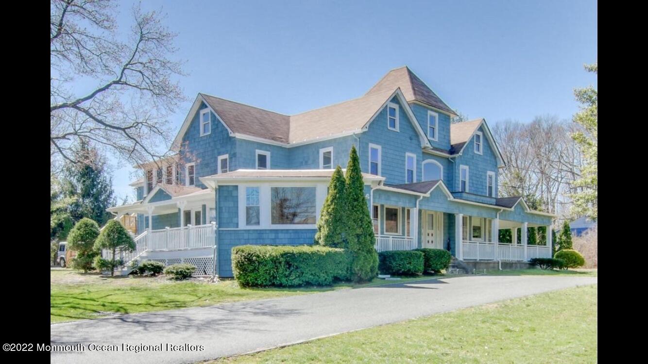 1737 Belmar Boulevard, Unit A Belmar, NJ 07719 - Photo 1 of 15 a front view of a house with a yard