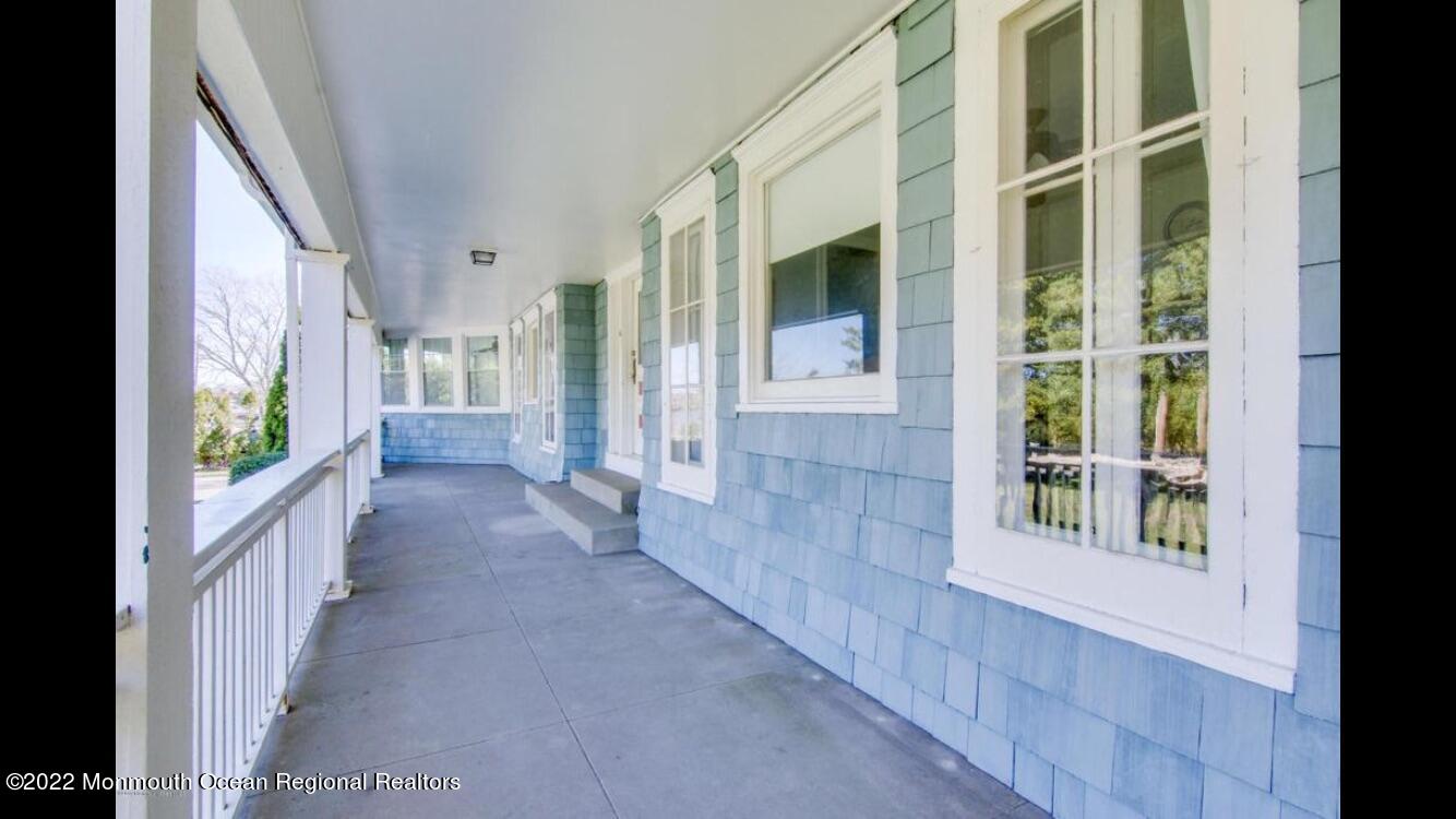 1737 Belmar Boulevard, Unit A Belmar, NJ 07719 - Photo 3 of 15 a view of a porch with windows