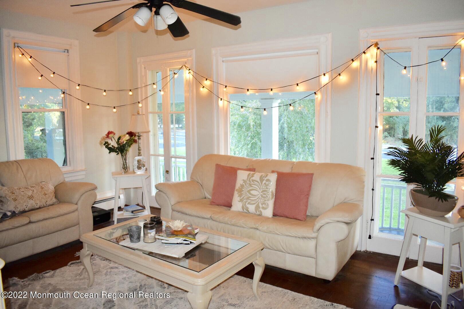 1737 Belmar Boulevard, Unit A Belmar, NJ 07719 - Photo 7 of 15 a living room with furniture and a large window