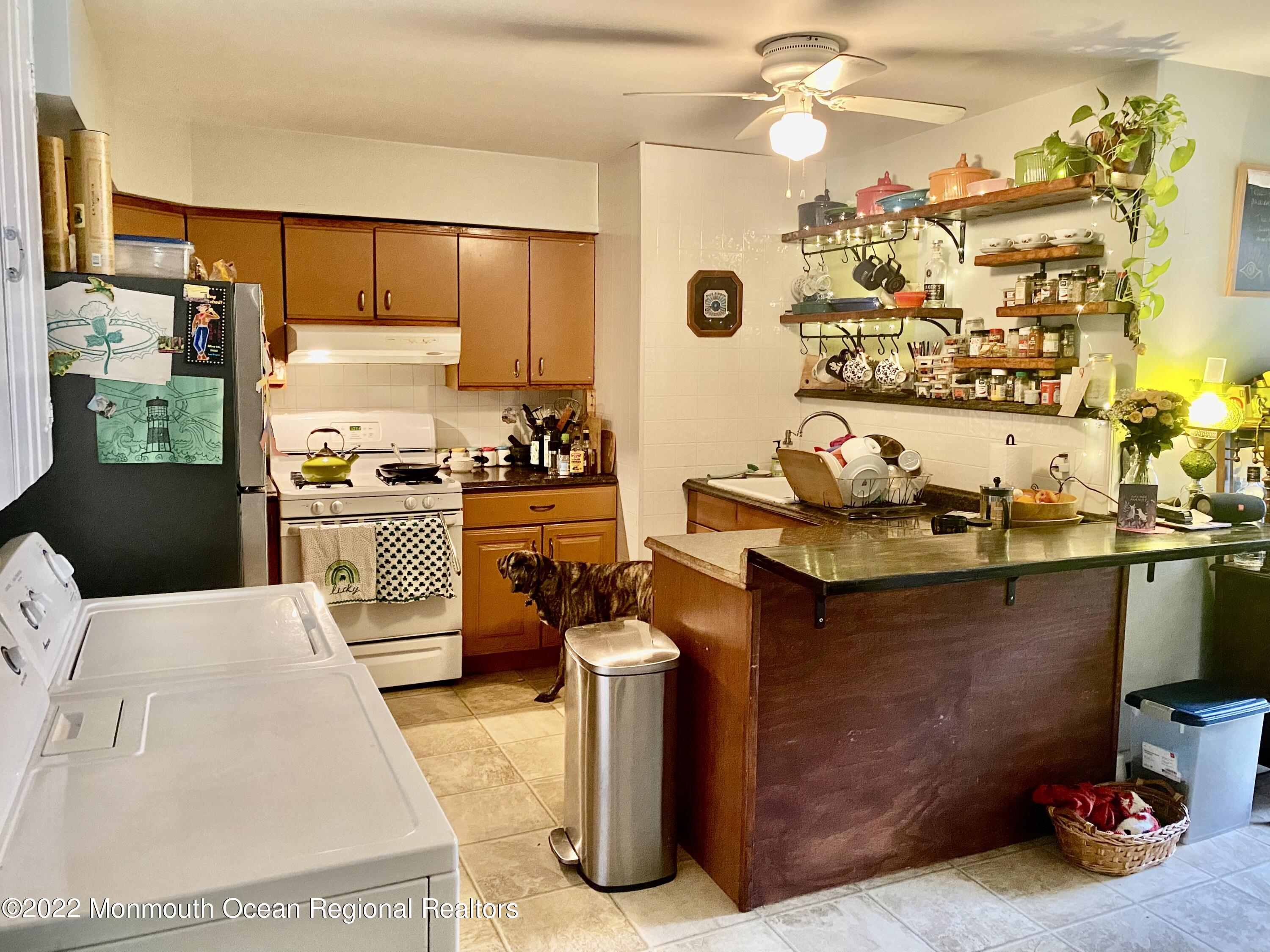 1737 Belmar Boulevard, Unit A Belmar, NJ 07719 - Photo 10 of 15 a kitchen with a sink appliances and cabinets