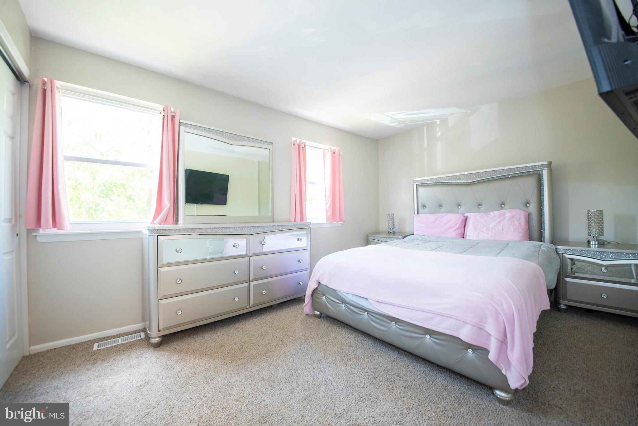 9355 Pan Ridge Road, Unit 9355 Parkville, MD 21234 - Photo 15 of 32 a bedroom with a bed and a window